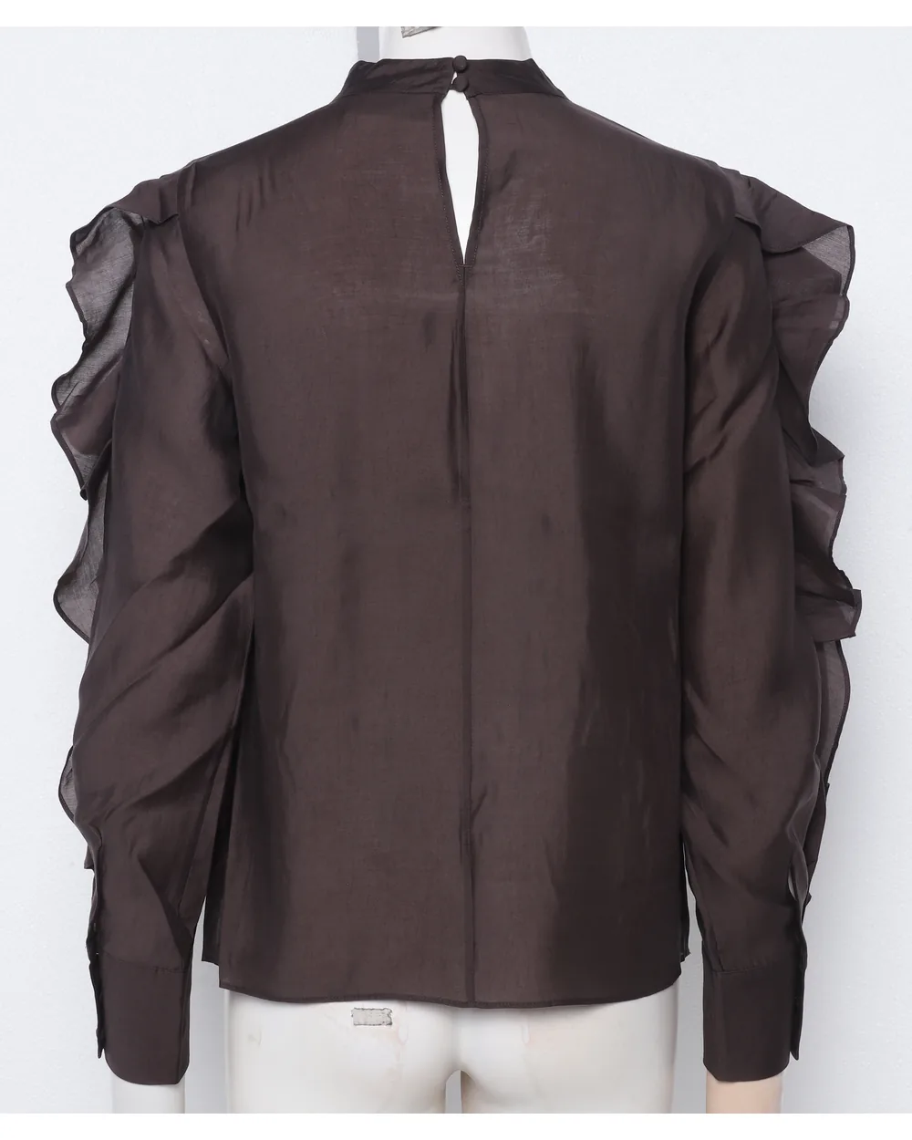Brown ruffle-sleeve blouse as shot on a mannequin