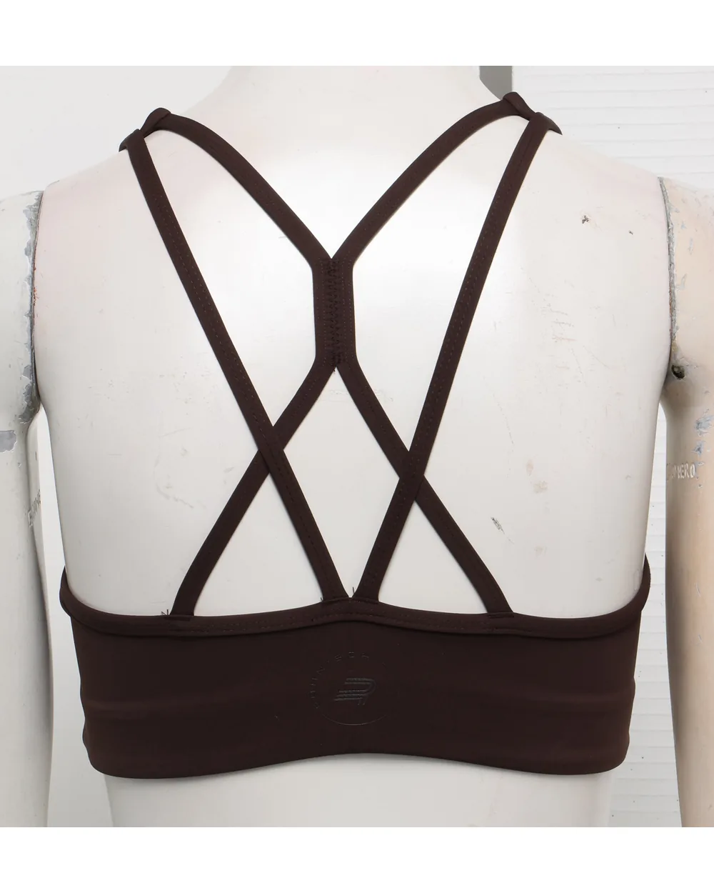 Brown sports bra as shot on a studio mannequin