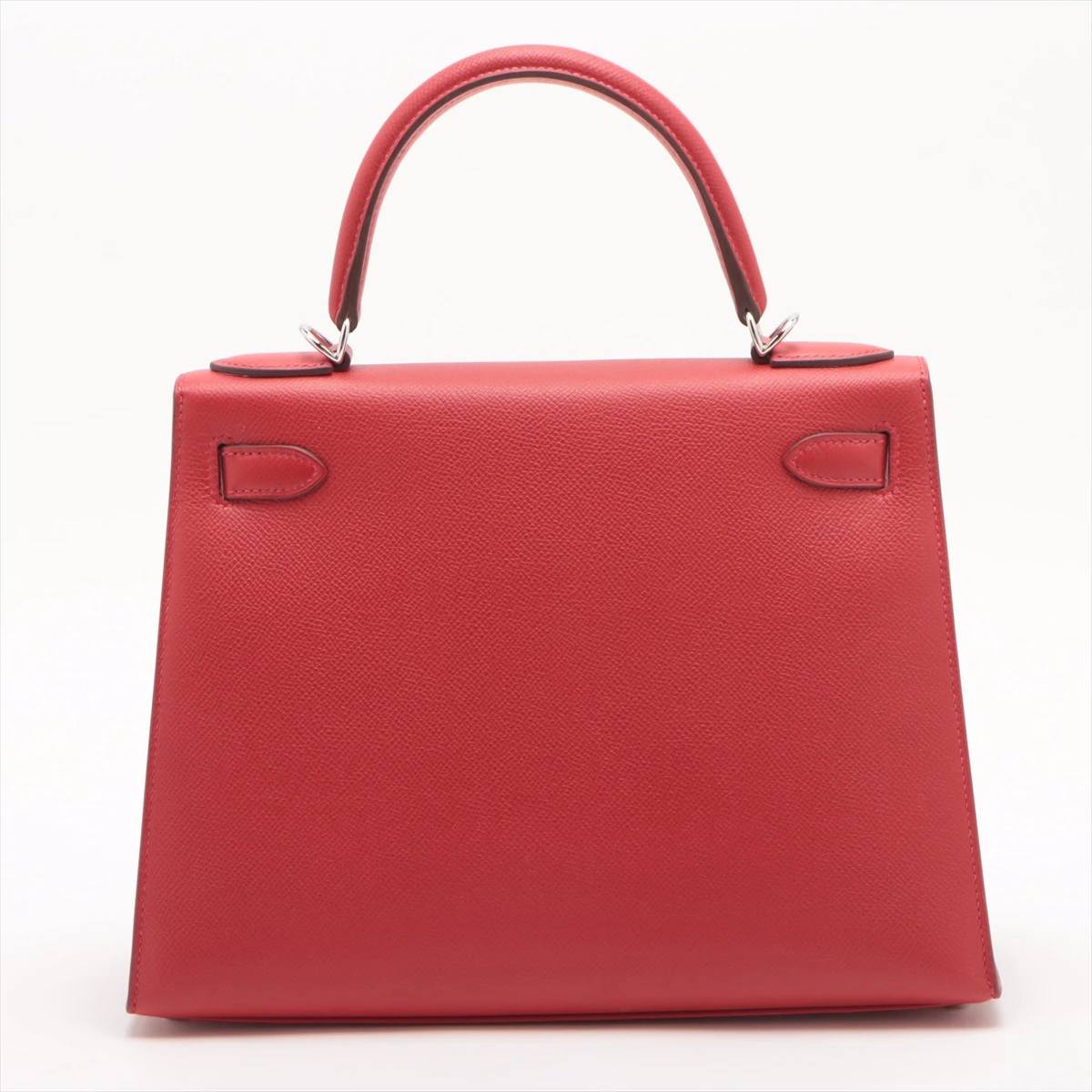 Red leather handbag as photographed in the studio