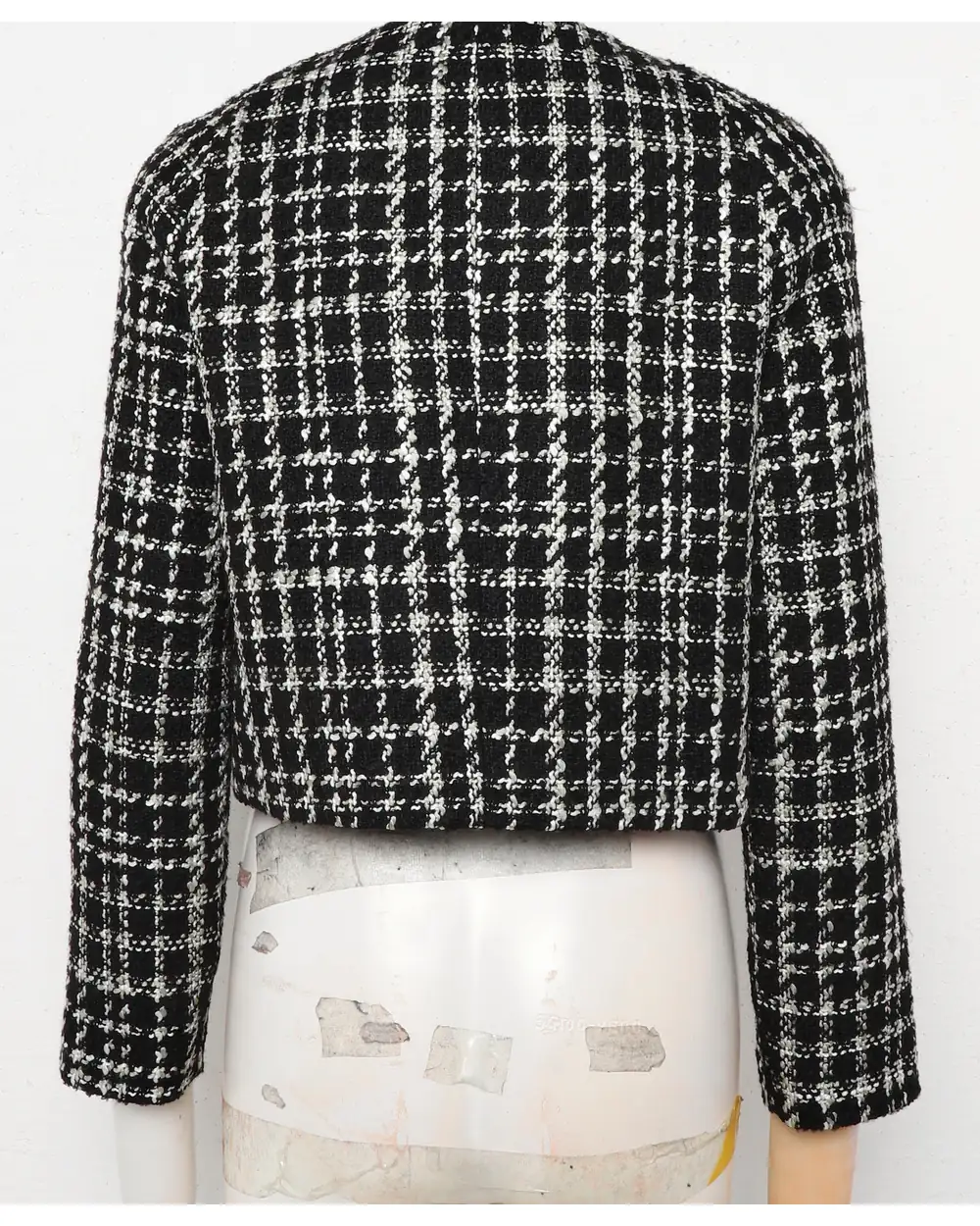 Houndstooth tweed jacket as shot on a mannequin
