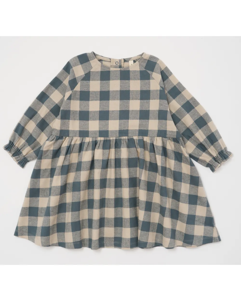Checked dress as shot on a studio backdrop