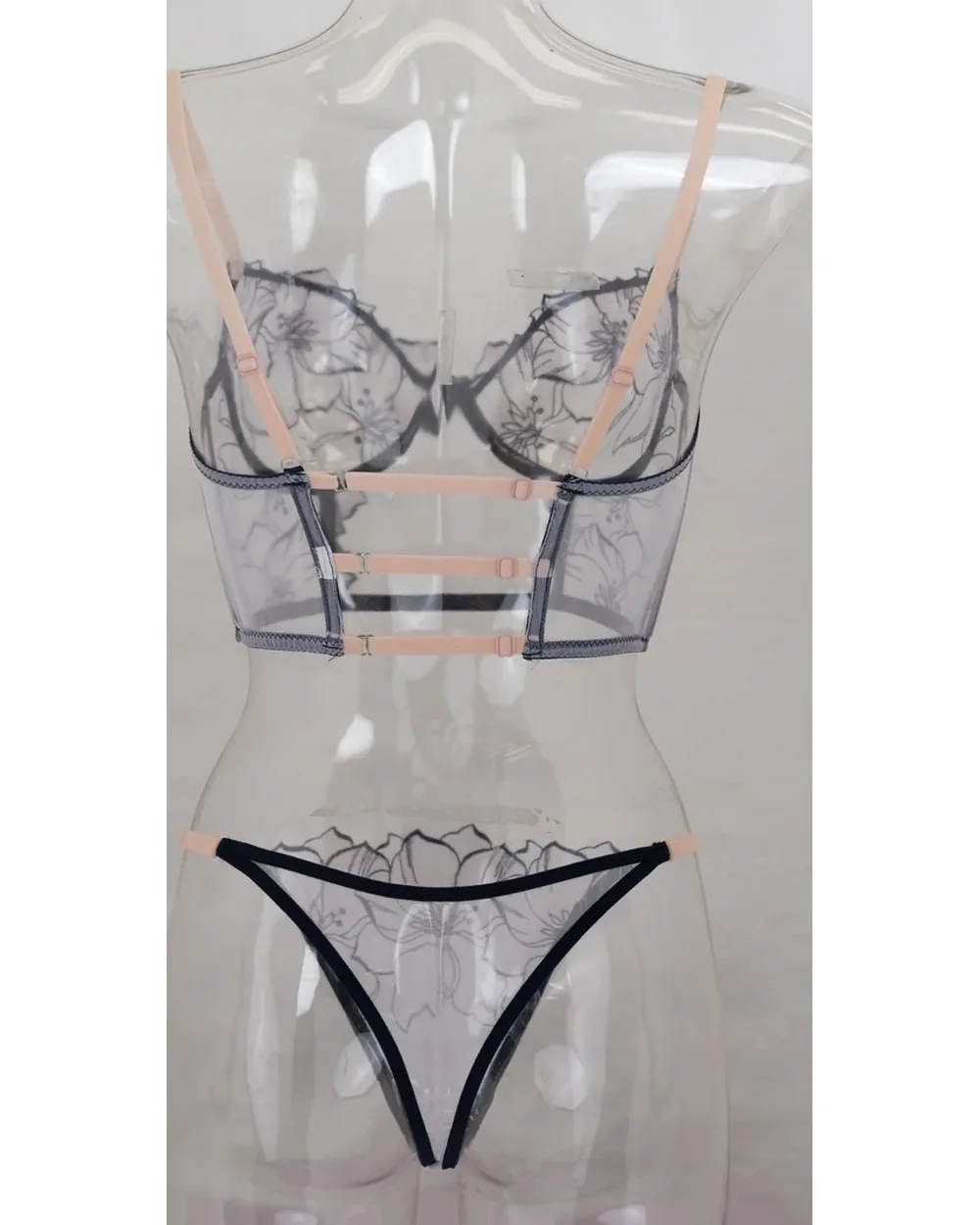 Lingerie set as shot on a clear acrylic form