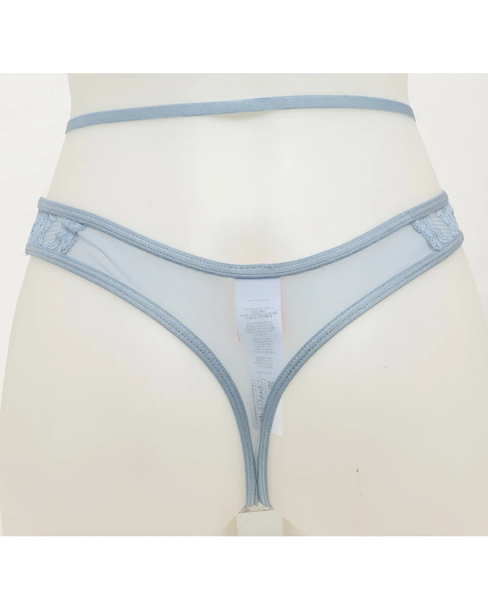 Sheer blue brief as shot on a studio backdrop