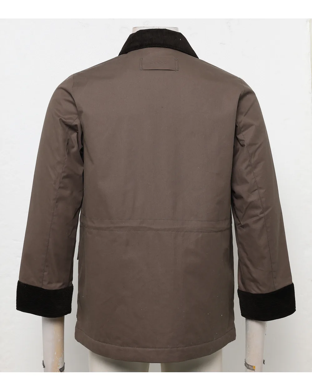 Khaki utility jacket as shot on a mannequin with the arms visible